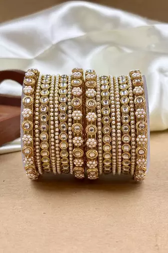 Golden studded pearl bangle set