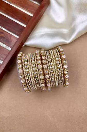 Golden studded pearl bangle set