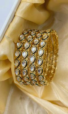 Gold designer bangle set with green touch for women 1