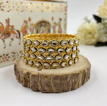 Gold designer bangle set with green touch for women 3