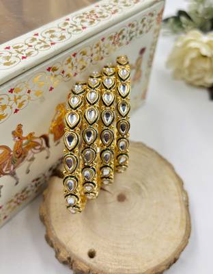 Gold designer bangle set with green touch for women 4