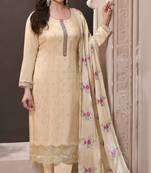 Cream silk embroidered semi-stitched salwar suit