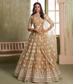 BEIGE NET FABRIC LAHENGA CHOLI WITH SEQUINS AND THREAD EMBROIDERY WORK