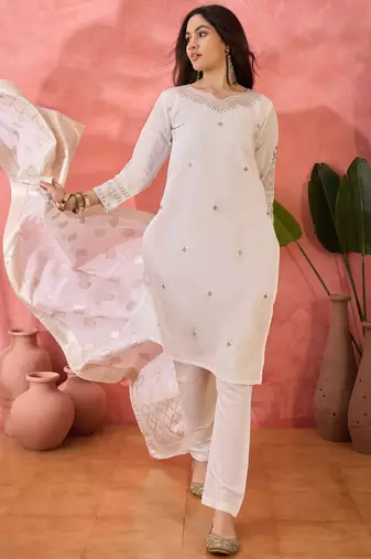 Off white roman silk suit designed with embroidery and wevon 