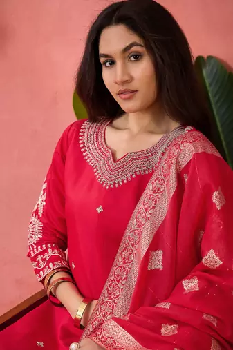 Pink roman silk suit designed with embroidery and wevon 