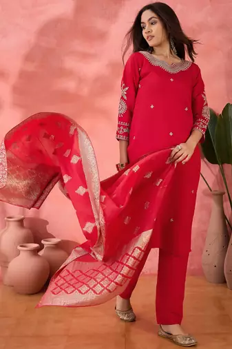 Pink roman silk suit designed with embroidery and wevon 