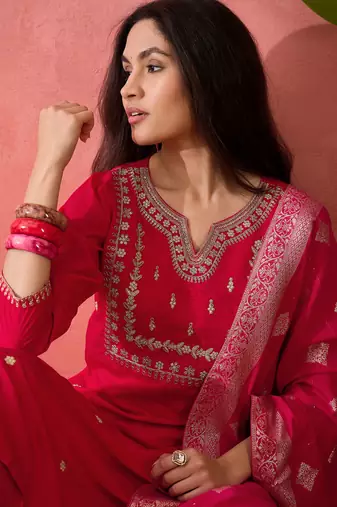 Pink roman silk suit designed with embroidery and wevon 