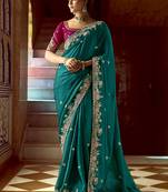 Teal green heavy border organza wedding wear saree