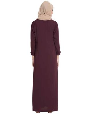 maroon front open abaya with ruffled panels and side pockets. 4