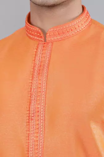    orange colour woven design kurta sets