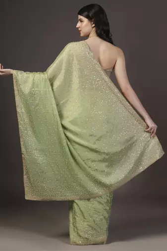 Green embellised tine dull sequins embroidered georgette saree with unstitched blouse sets of 2