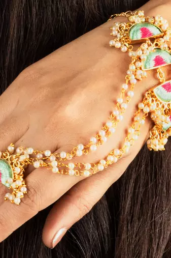 Mint wave haathphool in silk thread embroidery for pre-wedding occasions.