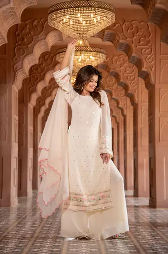Cream multi color thread work kurta with pallazzo set