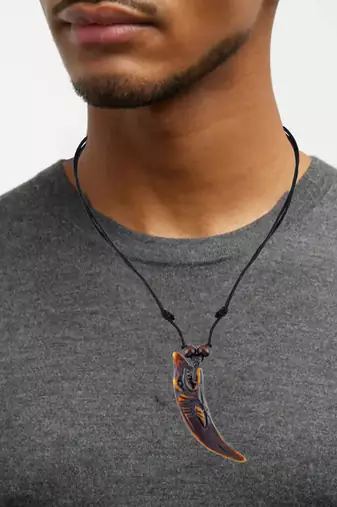 Polyresin dolphin in horn fashion pendant