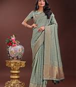 Light green organza woven zari work tassel saree