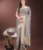 Grey organza woven zari work tassel saree