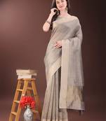 Beige organza woven zari work tassel saree