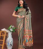 Green silk blend woven zari work tassel saree
