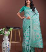 Sea green linen cotton woven zari work tassel saree