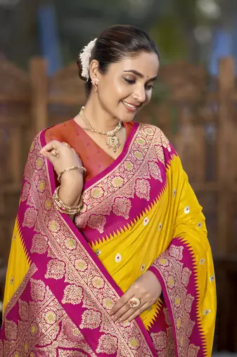 banarasi woven yellow and pink saree with heavy jacquard work