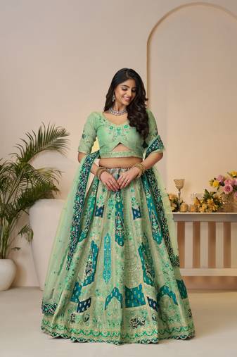 The Rajsi Haathi Collection: Graceful Green with  peacock Embroidered bridal lehenga