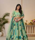 The Rajsi Haathi Collection: Graceful Green with  peacock Embroidered bridal lehenga