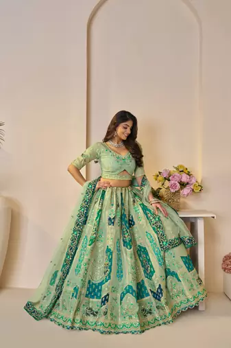 The Rajsi Haathi Collection: Graceful Green with  peacock Embroidered bridal lehenga
