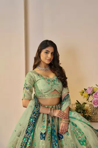 The Rajsi Haathi Collection: Graceful Green with  peacock Embroidered bridal lehenga