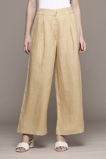 Beige essential-bottoms pants by ritu kumar