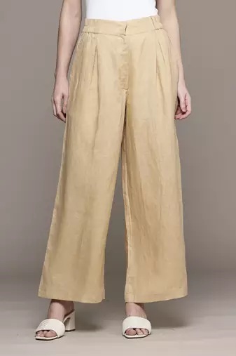 Beige essential-bottoms pants by ritu kumar