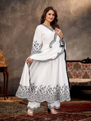 Designer traditional cambric cotton fabric white color heavy embroidery kurta set with dupatta 1