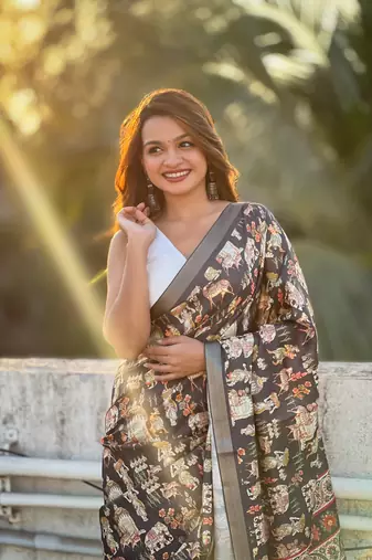 Black tussar silk blend printed saree with zari woven border