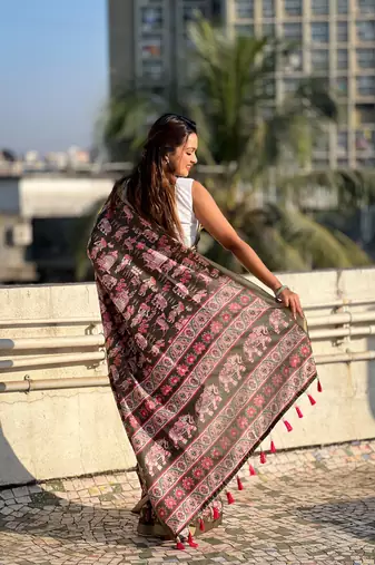Bottle green tussar silk blend printed saree with zari woven border