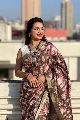 Bottle green tussar silk blend printed saree with zari woven border