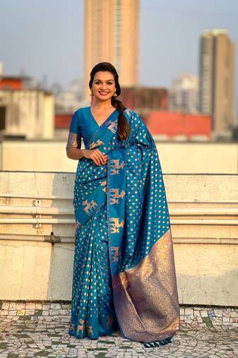 Blue soft silk blend dual zari woven saree with deer border