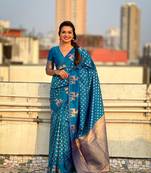 Blue soft silk blend dual zari woven saree with deer border