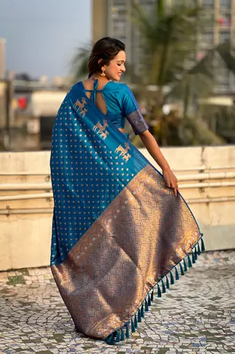 Blue soft silk blend dual zari woven saree with deer border