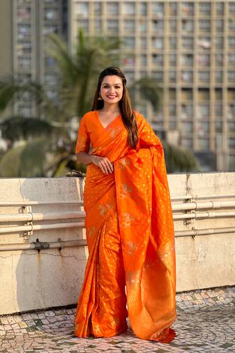 Orange soft silk blend dual zari woven saree with deer border