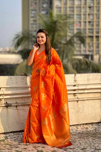 Orange soft silk blend dual zari woven saree with deer border