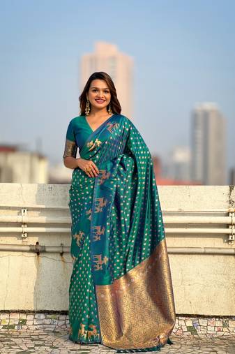 Green soft silk blend dual zari woven saree with deer border