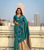 Green soft silk blend dual zari woven saree with deer border