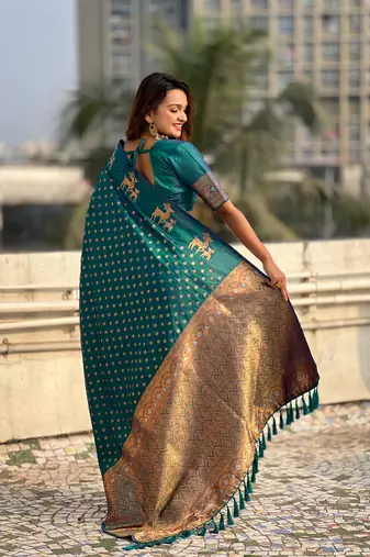 Green soft silk blend dual zari woven saree with deer border