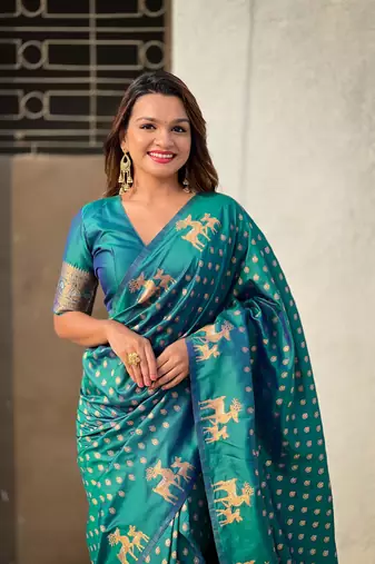 Green soft silk blend dual zari woven saree with deer border