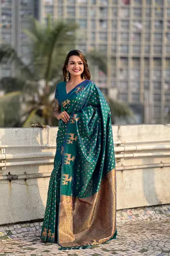 Green soft silk blend dual zari woven saree with deer border