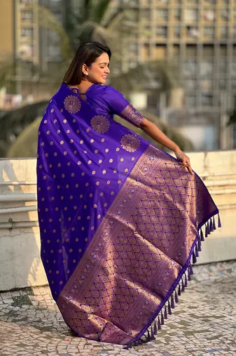 Violet soft silk blend dual zari woven saree with peacock border