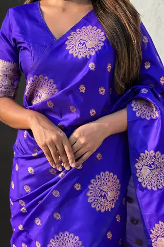 Violet soft silk blend dual zari woven saree with peacock border