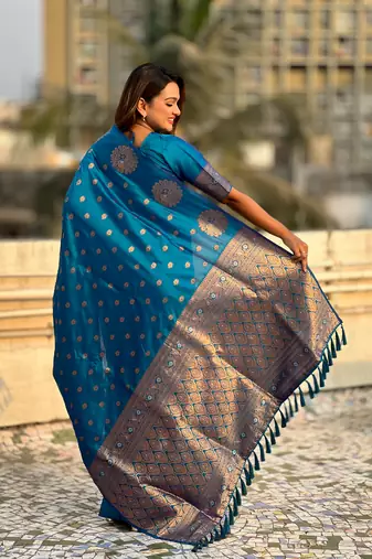 Blue soft silk blend dual zari woven saree with peacock border