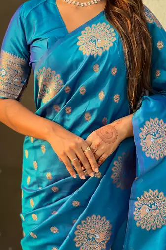 Blue soft silk blend dual zari woven saree with peacock border