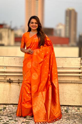 Orange soft silk blend dual zari woven saree with peacock border
