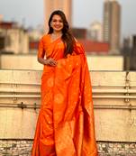 Orange soft silk blend dual zari woven saree with peacock border